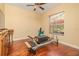 Spacious bedroom with beautiful hardwood flooring, ceiling fan and natural light from a window at 537 Montage Ln, Kissimmee, FL 34759