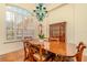 Charming dining room featuring light hardwood floors, and a unique chandelier with large shuttered window at 537 Montage Ln, Kissimmee, FL 34759