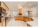 Bright kitchen featuring ample cabinet space, tile floors, stainless steel appliances, and lots of natural light at 537 Montage Ln, Kissimmee, FL 34759