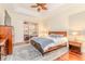 Cozy main bedroom with hardwood floors, a ceiling fan, and natural light from sliding glass doors at 537 Montage Ln, Kissimmee, FL 34759