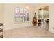 Inviting sitting area with tile flooring, window shutters and view of the screened lanai at 537 Montage Ln, Kissimmee, FL 34759