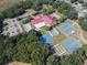 Aerial view of community amenities including pool, tennis courts, and clubhouse at 5712 Connors St, Leesburg, FL 34748