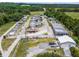 RV and boat storage with a service building are shown from above amid green space at 5712 Connors St, Leesburg, FL 34748