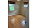 Bright bedroom featuring hardwood floors, natural light and neutral colors at 5712 Connors St, Leesburg, FL 34748