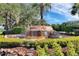 Highland Lakes entrance with a rock waterfall feature and lush surrounding greenery at 5712 Connors St, Leesburg, FL 34748