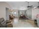 Inviting entryway with neutral color palette, tile flooring, and a bright, open dining area at 5712 Connors St, Leesburg, FL 34748