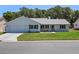 Charming single-story home with a well-manicured lawn and classic curb appeal at 5712 Connors St, Leesburg, FL 34748