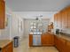 Functional kitchen with ample cabinetry, granite countertops, stainless steel appliances, and breakfast nook at 5712 Connors St, Leesburg, FL 34748