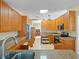 Bright kitchen with tile flooring, stainless steel appliances, and ample cabinet space at 5712 Connors St, Leesburg, FL 34748
