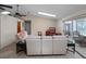 Open living room with skylights, comfortable seating and sliding glass door to the lanai at 5712 Connors St, Leesburg, FL 34748