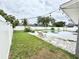 Backyard featuring a pool, lounge chairs and an outdoor lighting system at 607 Baldwin Dr, Kissimmee, FL 34758