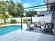 Inviting backyard featuring a pool, outdoor seating, and a grill at 607 Baldwin Dr, Kissimmee, FL 34758