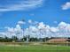 An outdoor baseball park field on a sunny day with a bright blue sky at 607 Baldwin Dr, Kissimmee, FL 34758