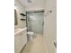 Beautiful bathroom featuring a glass shower with marble tiling, vanity, and modern fixtures at 607 Baldwin Dr, Kissimmee, FL 34758