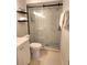 Modern bathroom with a sleek glass-enclosed shower and a tiled floor at 607 Baldwin Dr, Kissimmee, FL 34758