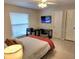 Comfortable bedroom with desk and ample natural light, ideal for relaxation and productivity at 607 Baldwin Dr, Kissimmee, FL 34758