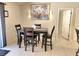 Cozy dining area featuring a stylish table set and decorative wall art at 607 Baldwin Dr, Kissimmee, FL 34758