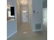 Tiled entryway featuring a white front door, leading into the home at 607 Baldwin Dr, Kissimmee, FL 34758