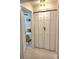 Hallway featuring a bedroom entrance and a white closet at 607 Baldwin Dr, Kissimmee, FL 34758