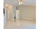 Spacious living room featuring a ceiling fan, vaulted ceilings, and tile flooring at 607 Baldwin Dr, Kissimmee, FL 34758