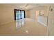 Expansive living room featuring tile flooring, lots of light, and an open floor plan at 607 Baldwin Dr, Kissimmee, FL 34758