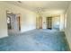 Large bedroom featuring ceiling fan and multiple closets at 608 Saint Andrews Blvd, Lady Lake, FL 32159