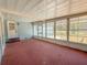 Bright sunroom with ample windows, outdoor access, and great natural lighting at 608 Saint Andrews Blvd, Lady Lake, FL 32159