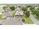 Well-maintained home featuring a screened-in lanai and mature landscaping in a quiet residential neighborhood at 616 Hartford Ln, The Villages, FL 32162