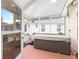 Enjoy the outdoors with this back patio with a partially covered hot tub for relaxing and entertaining at 616 Hartford Ln, The Villages, FL 32162