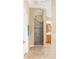 Modern bathroom with glass shower, tile flooring, and vanity at 616 Hartford Ln, The Villages, FL 32162