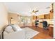 Spacious office with hardwood floors, built-in bookshelves, and a bay window at 616 Hartford Ln, The Villages, FL 32162