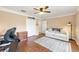 Bright office with hardwood floors, built-in bookshelves, and a sofa at 616 Hartford Ln, The Villages, FL 32162