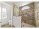 Bathroom shower with custom tile work, niche, grab bars and glass enclosure at 6259 Se 120Th Pl, Belleview, FL 34420