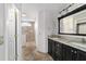 Bathroom featuring a double vanity and a luxurious tiled shower with a glass door at 6259 Se 120Th Pl, Belleview, FL 34420