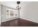 Bright dining room featuring hardwood floors, a modern chandelier, and a charming bay window at 6259 Se 120Th Pl, Belleview, FL 34420