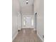 Bright foyer featuring tile flooring, natural light, and access to other rooms in the home at 6259 Se 120Th Pl, Belleview, FL 34420