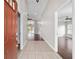 Bright foyer showcasing tile flooring, a high ceiling, and an open view into the living space at 6259 Se 120Th Pl, Belleview, FL 34420