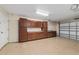 Spacious garage with lots of cabinet storage space and a garage door at 6259 Se 120Th Pl, Belleview, FL 34420