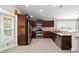 Updated kitchen featuring stainless steel appliances, dark cabinets, and modern backsplash at 6259 Se 120Th Pl, Belleview, FL 34420