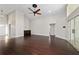 Bright, open living room with dark hardwood floors and neutral paint provides a versatile living space at 6259 Se 120Th Pl, Belleview, FL 34420