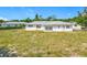 Exterior backyard shot of home, landscaping and home exterior at 670 Oleander St, Mount Dora, FL 32757
