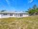 Spacious backyard featuring the home's exterior, perfect for outdoor activities and relaxation at 670 Oleander St, Mount Dora, FL 32757