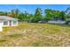 Large backyard offering plenty of space for gardening, recreation, and enjoying the outdoors at 670 Oleander St, Mount Dora, FL 32757