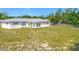 Exterior home view showcasing the backyard, perfect for outdoor living and activities at 670 Oleander St, Mount Dora, FL 32757
