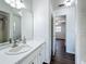 Bathroom featuring a white vanity with a large mirror and modern fixtures at 670 Oleander St, Mount Dora, FL 32757