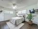Comfortable bedroom featuring neutral tones, laminate flooring, and natural light at 670 Oleander St, Mount Dora, FL 32757