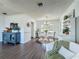 Open dining room area with elegant chandelier, neutral colors and a bright sunny window at 670 Oleander St, Mount Dora, FL 32757