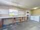 Garage features a workbench, laundry hookups, and peg board at 670 Oleander St, Mount Dora, FL 32757