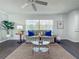 Inviting living room with contemporary decor, plush seating, and a stylish area rug, perfect for gatherings at 670 Oleander St, Mount Dora, FL 32757