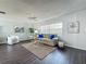 Comfortable living room featuring neutral colors, cozy seating, and ample natural light creating a cozy atmosphere at 670 Oleander St, Mount Dora, FL 32757